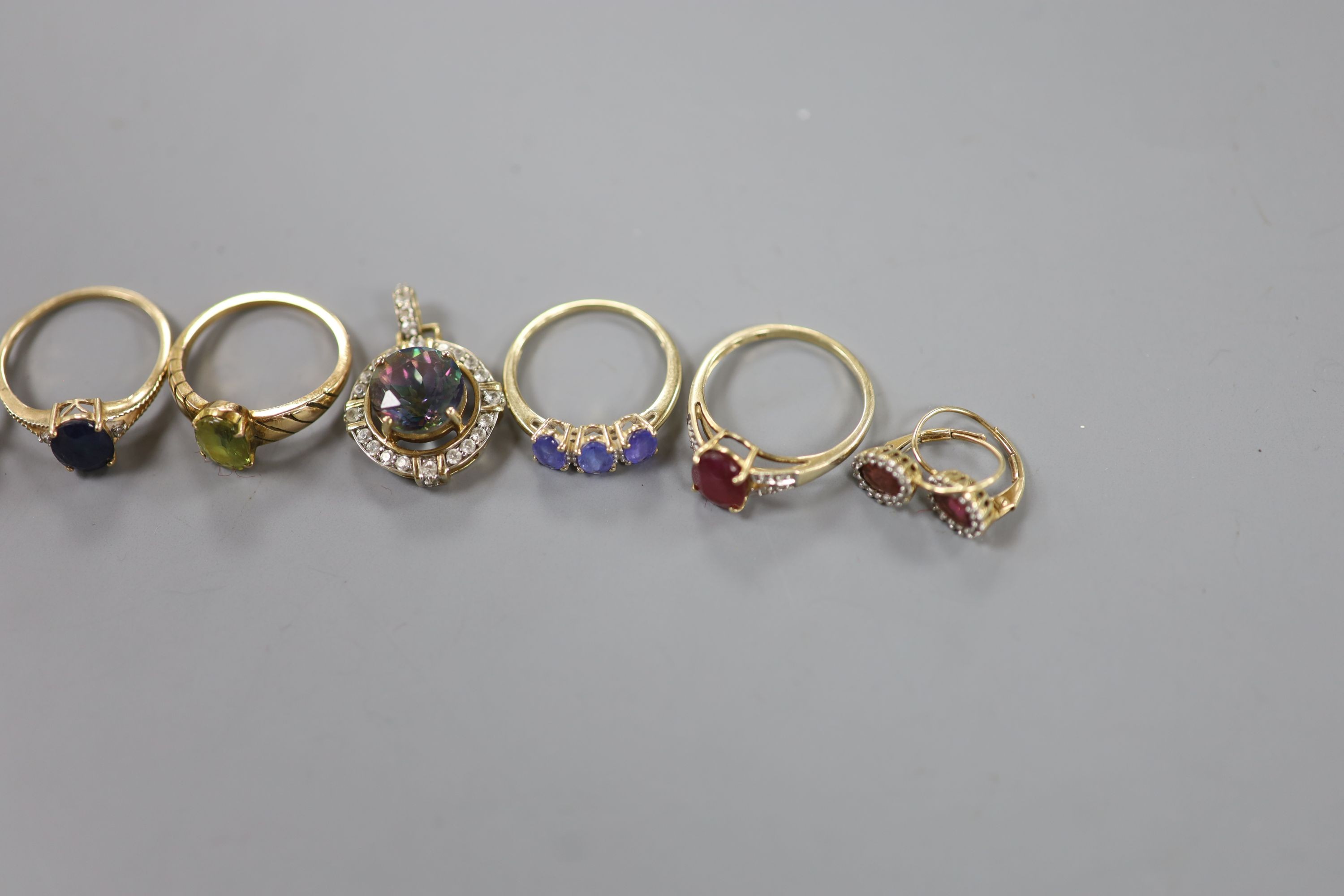 Six assorted modern 9ct gold and gem set dress rings, a pair of 9ct and gem set earrings and two 9ct gold and gem set pendants, gross weight 22.2 grams, a yellow metal and olivine? ring, gross 3.7 grams and a pair of 925